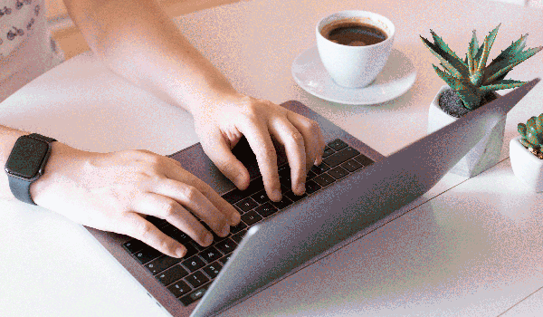 Person typing on a laptop